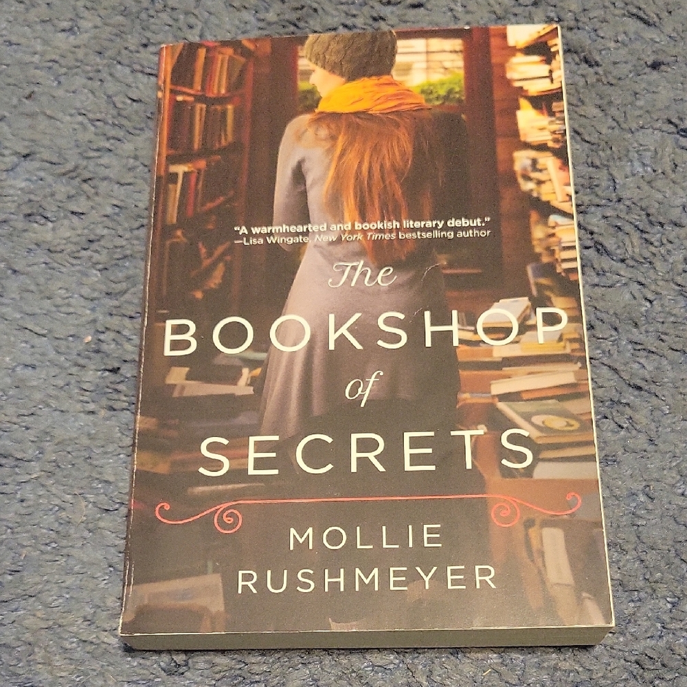 The Bookshop of Secrets by Mollie Rushmeyer - Cozy Cover with Mustard Scarf